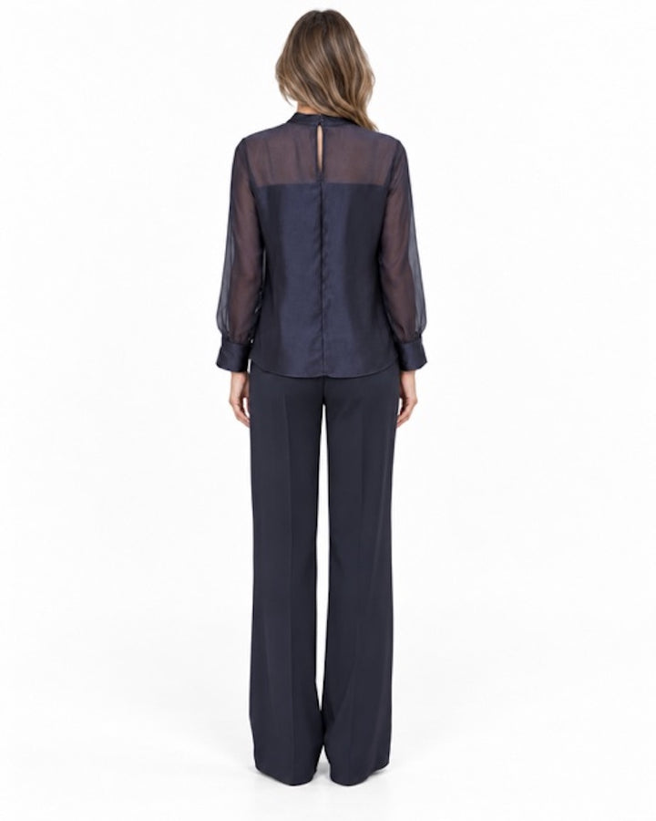 Natan women's navy FLAIR blouse with sheer sleeves and upper back panel, rear view on model